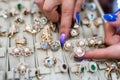 Female hands with golden jewellery in shop close up Royalty Free Stock Photo