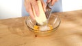 female hands grate cheese over a bowl of eggs. cooking pasta carbonara. Royalty Free Stock Photo