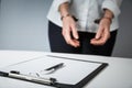 Female hands in handcuffs fill out police report recognition Royalty Free Stock Photo