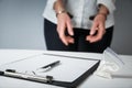 Female hands in handcuffs fill out police report recognition Royalty Free Stock Photo