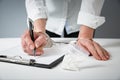 Female hands in handcuffs fill out police report recognition Royalty Free Stock Photo