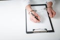 Female hands in handcuffs fill out police report recognition Royalty Free Stock Photo