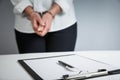 Female hands in handcuffs fill out police report recognition Royalty Free Stock Photo