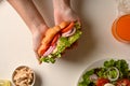 A female hands with healthy chicken croissant Royalty Free Stock Photo