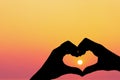 Female hands heart shape on sunset sky at tropical beach abstract background. Copy space of happy love travel and freedom in Royalty Free Stock Photo