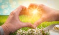 Female hands in a heart shape with sunshine. Thank you concept for doctors, nurses and medical staff. Royalty Free Stock Photo