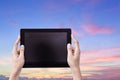 Female Hands Hoding Tablet with Bueatiful sunset sky Royalty Free Stock Photo