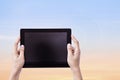 Female Hands Hoding Tablet with Bueatiful sunset sky Royalty Free Stock Photo