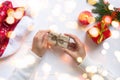 Female hands hold craft gift box tied with jute rope. Concept of gifts for Christmas and New Year Royalty Free Stock Photo