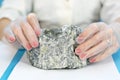 Female hands hold the dangerous mineral asbestos Royalty Free Stock Photo