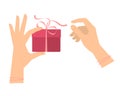 Female hands hold a gift and untie the ribbon. Royalty Free Stock Photo