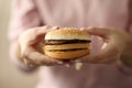 Female hands hold hamburger close-up Royalty Free Stock Photo