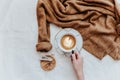 Female hands hold latte coffee cup,