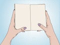 Female hands hold an open notebook. Blank for notes, diary. Drawing, Pop art background. Vector Royalty Free Stock Photo