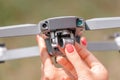 hands hold the ua drone and check the functionality of the camera suspension and gimbal