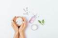 Female hands hold wooden bowl of sea bath salt Royalty Free Stock Photo