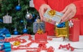 Female hands hold wrapped silver gift box for Christmas Royalty Free Stock Photo