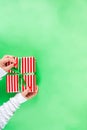 Female hands hold xmas gift boxes, champagne and glasses Royalty Free Stock Photo