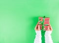 Female hands hold xmas gift boxes, champagne and glasses Royalty Free Stock Photo