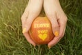 Female hands holding apple with I love you print Royalty Free Stock Photo