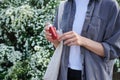 Female hands holding asthma inhaler on attack outdoor. Health and medical concept Royalty Free Stock Photo