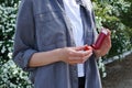 Female hands holding asthma inhaler on attack outdoor. Health and medical concept Royalty Free Stock Photo