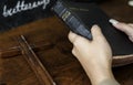 Female hands holding a bible and a wooden cross Royalty Free Stock Photo