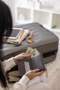 Female hands holding cash money dollars in wallet with cards ready travel vacation or business trip