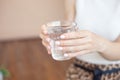 Female hands holding a clear glass of water.A glass of clean mineral water in hands, healthy drink Royalty Free Stock Photo