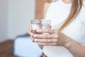 Female hands holding a clear glass of water.A glass of clean mineral water in hands, healthy drink Royalty Free Stock Photo