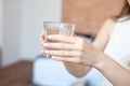 Female hands holding a clear glass of water.A glass of clean mineral water in hands, healthy drink. Royalty Free Stock Photo