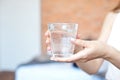 Female hands holding a clear glass of water.A glass of clean mineral water in hands, healthy drink Royalty Free Stock Photo