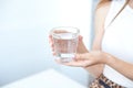 Female hands holding a clear glass of water.A glass of clean mineral water in hands, healthy drink Royalty Free Stock Photo