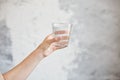 Female hands holding a clear glass of water.A glass of clean mineral water in hands, healthy drink Royalty Free Stock Photo