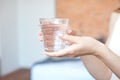 Female hands holding a clear glass of water.A glass of clean mineral water in hands, healthy drink Royalty Free Stock Photo