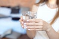 Female hands holding a clear glass of water.A glass of clean mineral water in hands, healthy drink Royalty Free Stock Photo