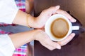 Woman`s hands holding coffee cup Royalty Free Stock Photo