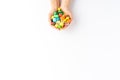 Female hands holding colourful sweets and candies isolated on white background with copyspace. Royalty Free Stock Photo