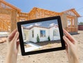 Female Hands Holding Computer Tablet with Finished House on Screen