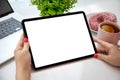 Female hands holding computer tablet with isolated screen with laptop Royalty Free Stock Photo