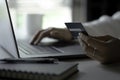 Female hands holding credit card and using laptop. Online shopping Royalty Free Stock Photo