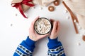 Female hands holding cup of hot chocolate with marshmallow. Christmas beverage, tasty cookies, gift box on white background. Girl Royalty Free Stock Photo