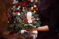 Female hands holding fir branches decorated for Royalty Free Stock Photo