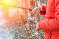 Female hands holding a fishing rod. Royalty Free Stock Photo