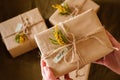 Female hands holding gift boxes decorated with yellow flowers a thank you. Appreciate Concept. top view Royalty Free Stock Photo