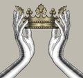 Female hands holding a gold crown