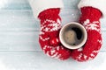 Female hands holding hot coffee above wooden table Royalty Free Stock Photo