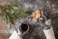 Female hands holding hot coffee above wooden table. Top view wit Royalty Free Stock Photo