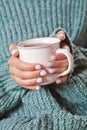 Female hands holding hot cup of coffee or tea Royalty Free Stock Photo