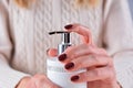 Feminine Hand with Liquid Soap Bottle and Stylish Brown Nail Color Royalty Free Stock Photo